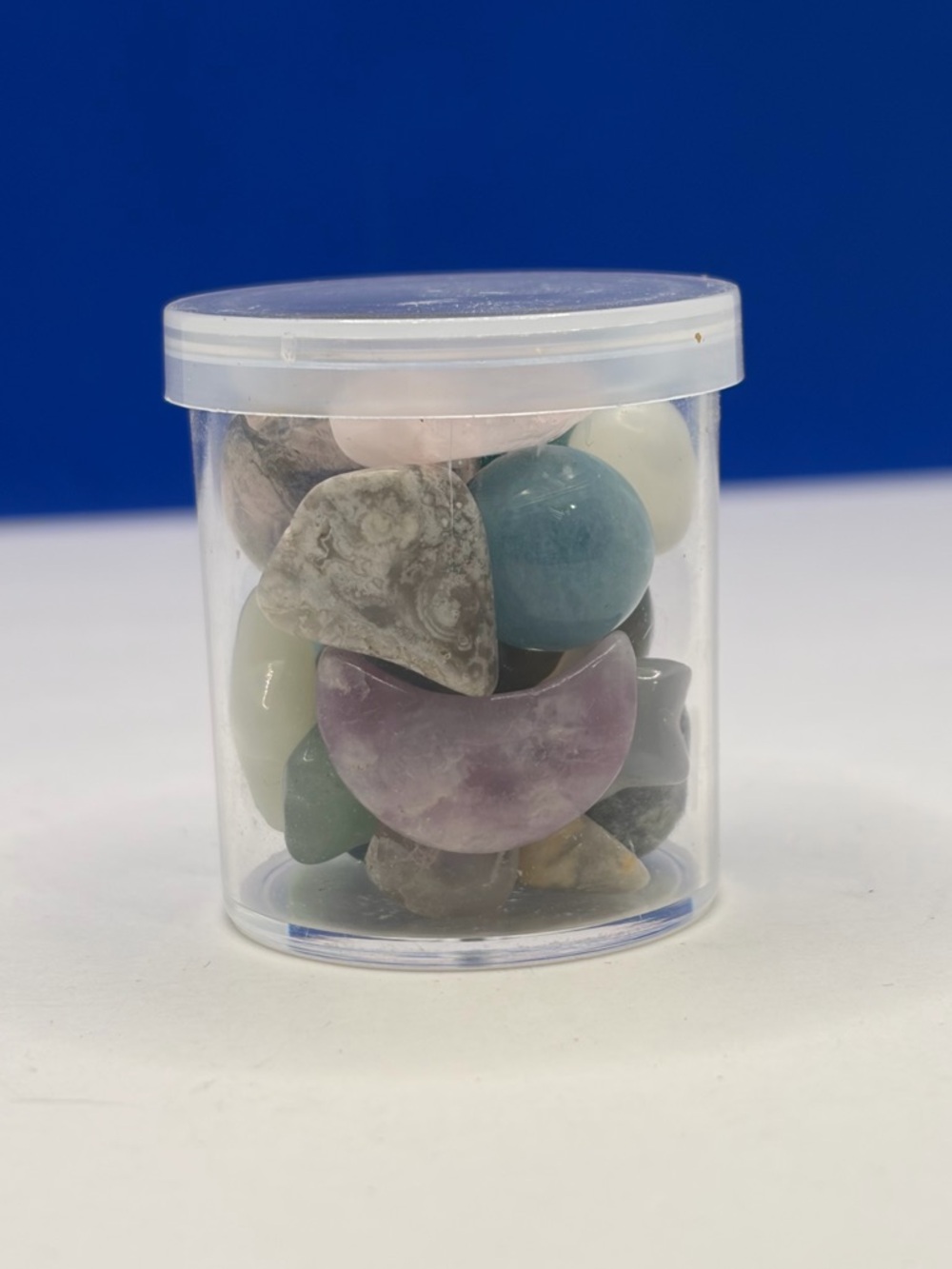 Assorted Polished Crystal Tumbles in 1” Clear Storage Jar - Picture 1 of 5